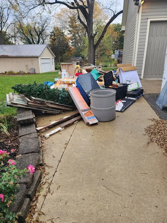 Dumpster being loaded with debris for 3 Yard Dumpster Rental in Bolivar